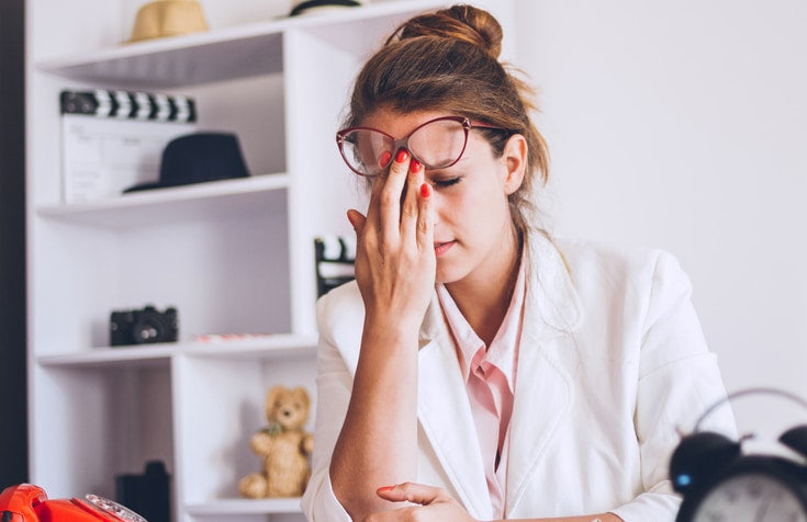 businesswoman tired from work in the office