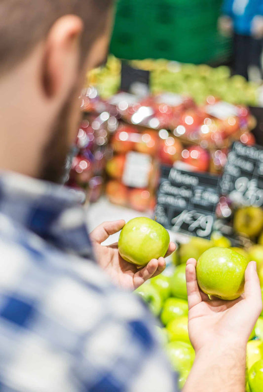 Man comparing apples