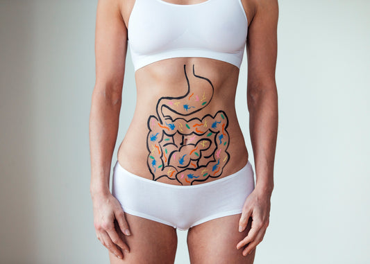 woman wearing white sports bra and underwear with diagram of metabolism process drawn on her stomach